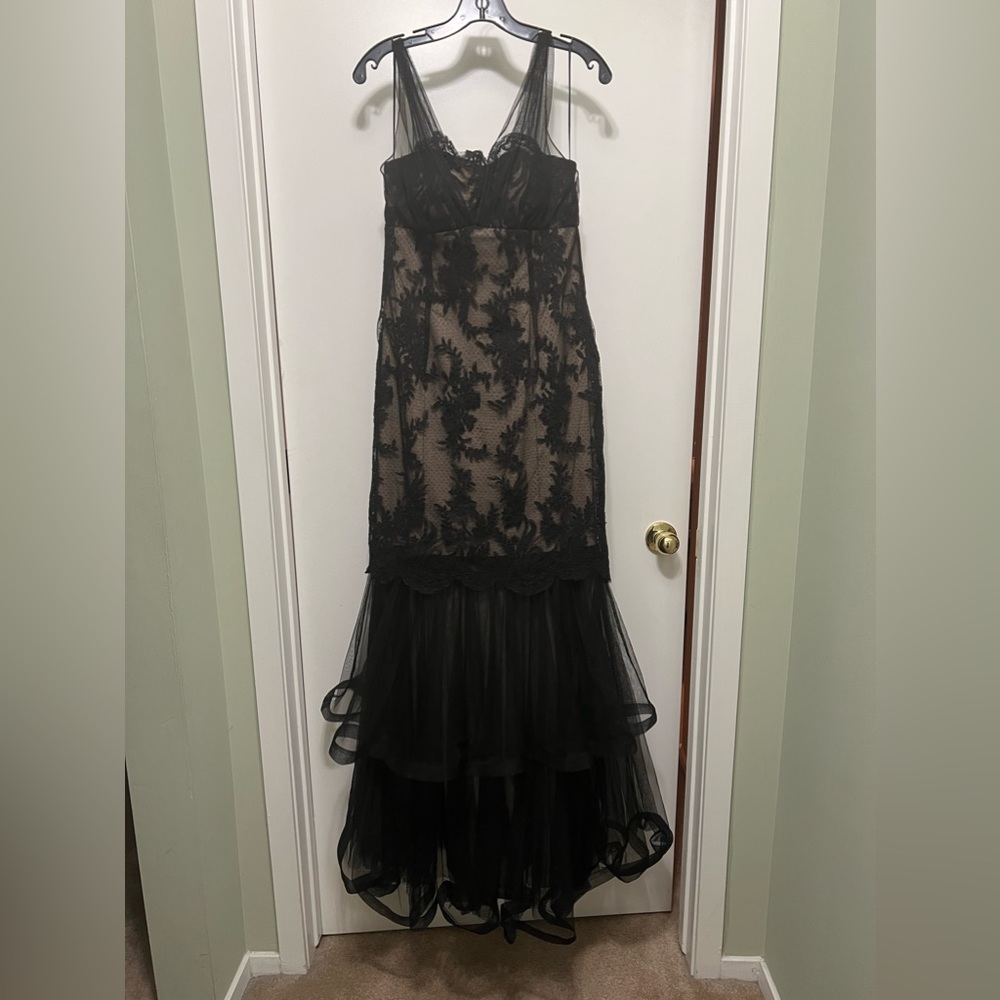 Black evening gown dress. Lace size 8 worn once. It has a built in bra. Like new